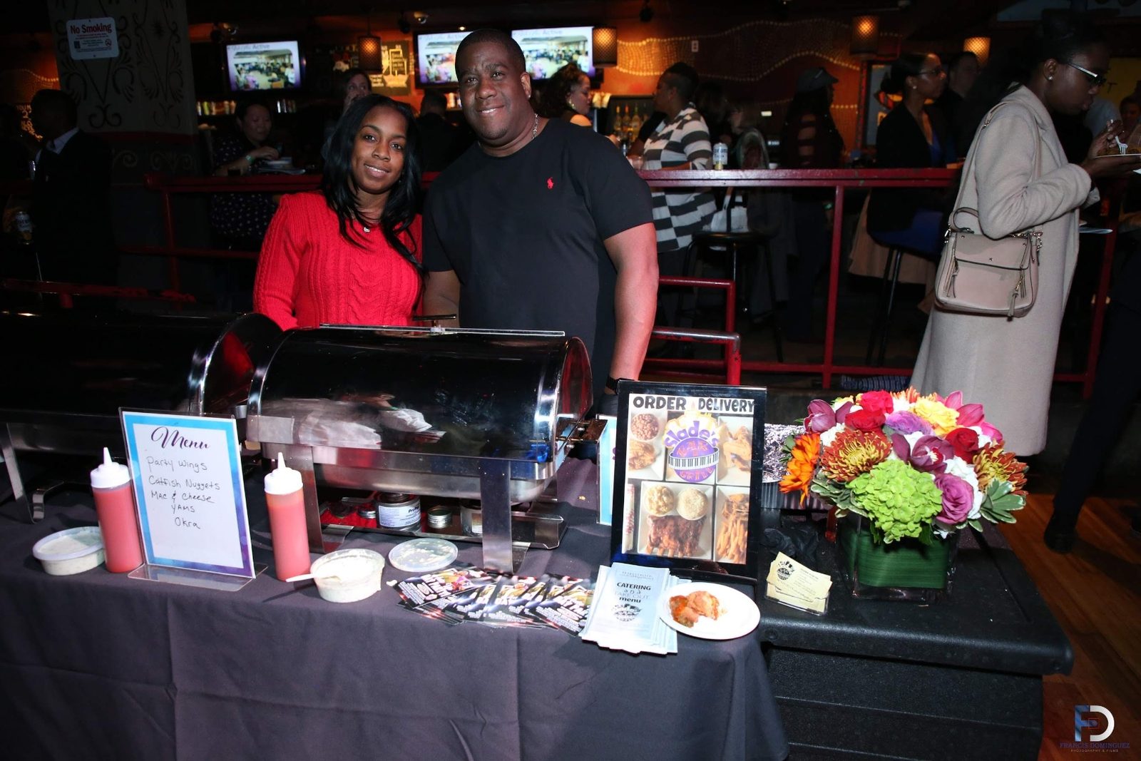 Catering table with chafing dish and menu at a Slade's Bar and Grill tasting event in Boston