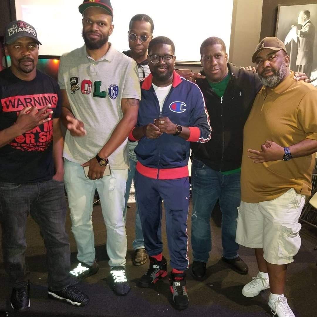 Group of guests posing together during an event night at Slade's Bar and Grill in Boston