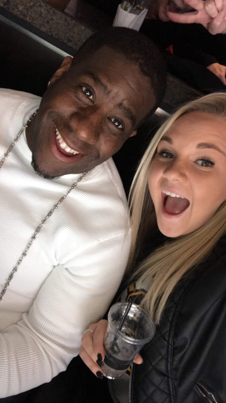 Team member with a guest at the bar at Slade's Bar and Grill in Boston