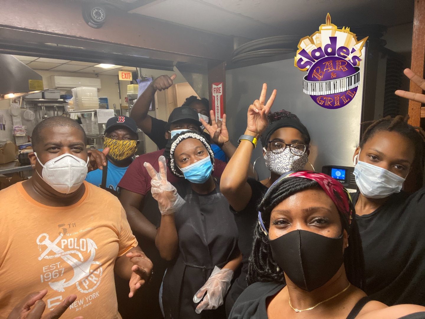 Kitchen and service crew at Slade's Bar and Grill in Boston wearing masks during the pandemic